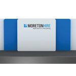 A Custom Stage Package features blue and white panels with the "Moreton Hire" logo and tagline, "experience is everything.